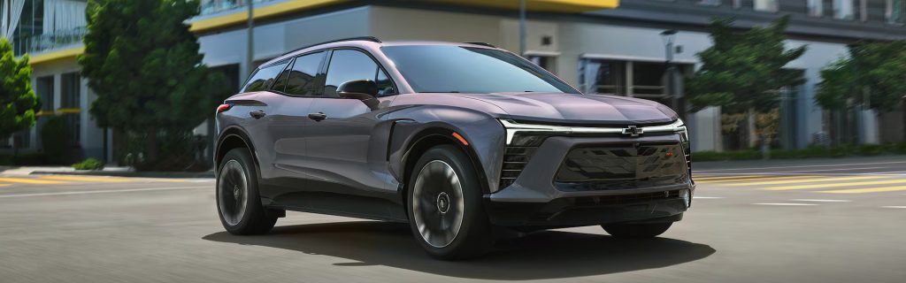 Gray Chevrolet Trax driving on a city street