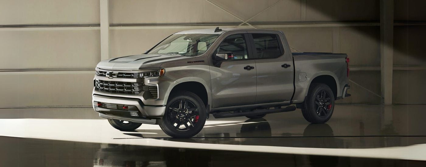 Silver 2024 Chevy Silverado 1500 Redline parked in a warehouse
