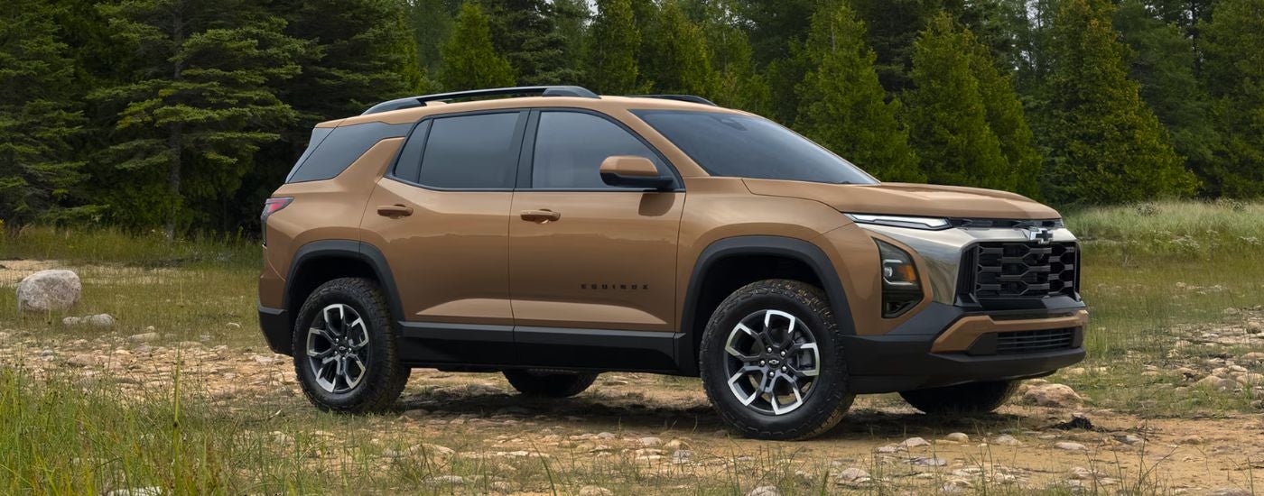 A light brown 2027 Chevy Equinox angled right off-road.